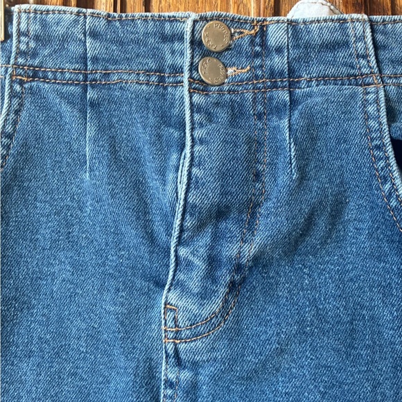 Free People distressed denim mini skirt with a buckle back and raw hem. - Picture 5 of 16